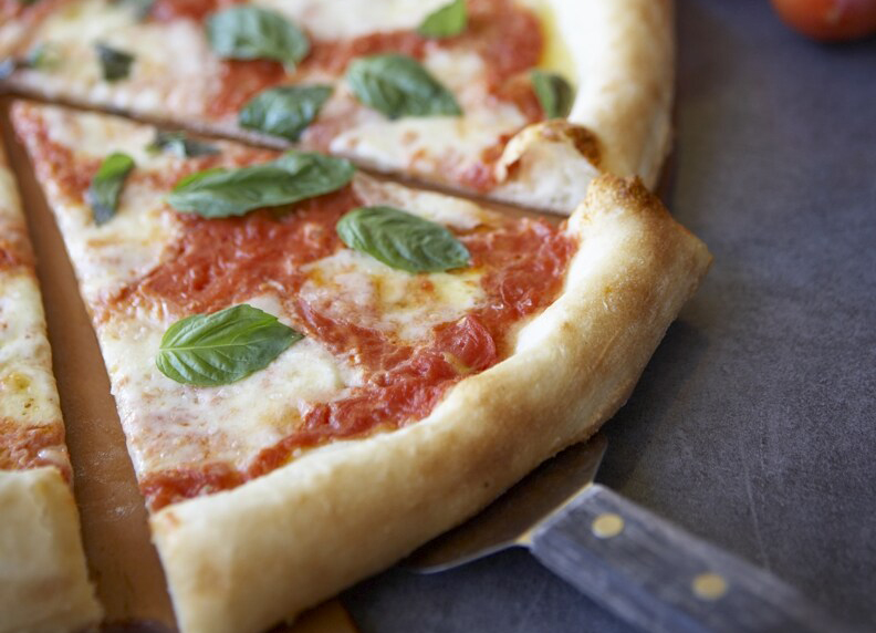 A slice of margherita pizza.
