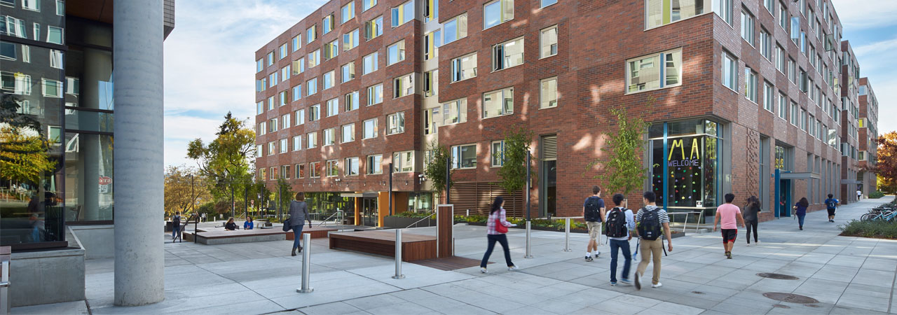 Students walking next to Maple Hall