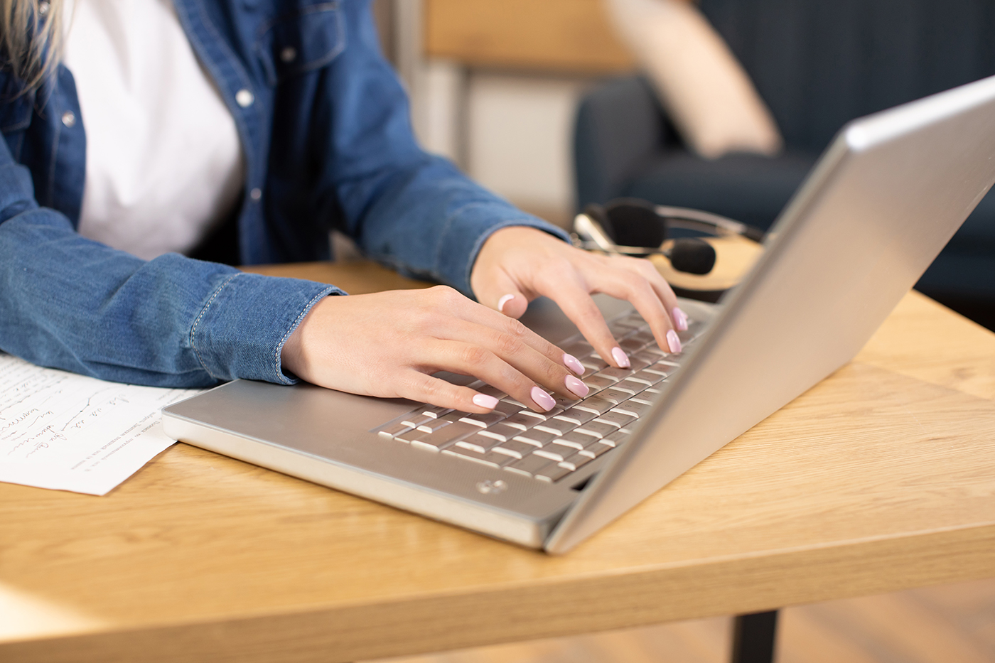 A person typing on a laptop.