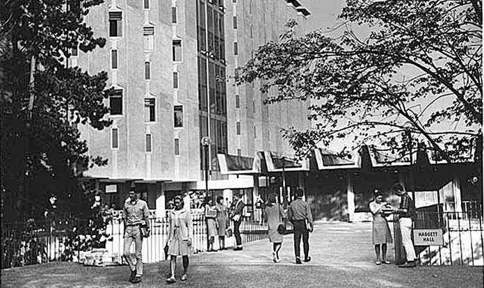 Black and white photograph of students gathering outside Haggett Hall 1966