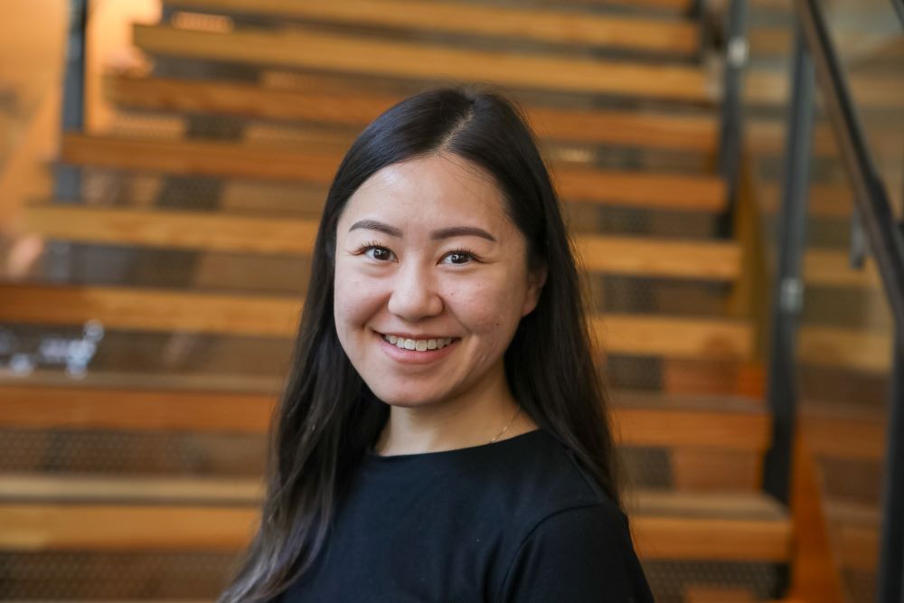 Woman in black shirt smiling