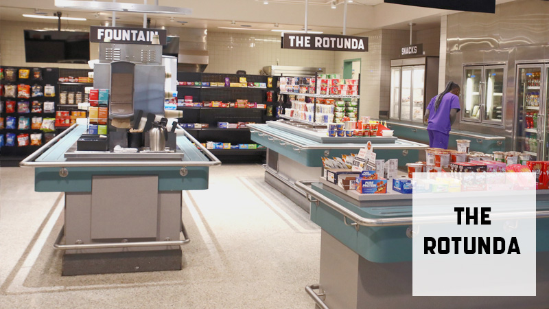 A person looking in fridge at The Rotunda.