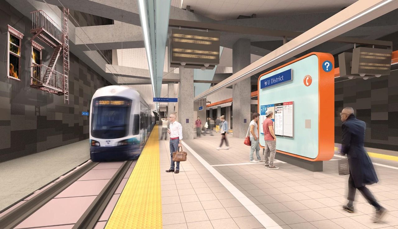 People waiting on the platform at the U-District Link Light Rail station