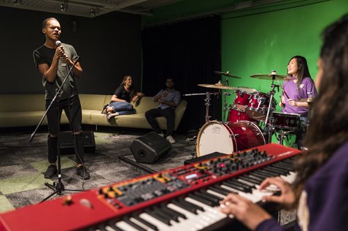 Students sing and play instruments in the Sound Lab