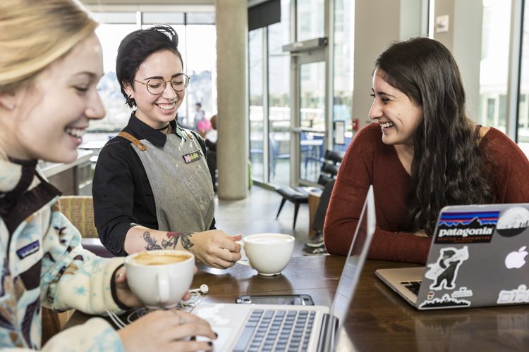 Two students study at Husky Grind Cafe.