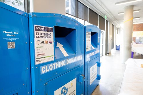 A blue donation bin that says Clothing Donations