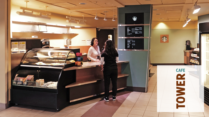 A person ordering at the counter at Tower Cafe.