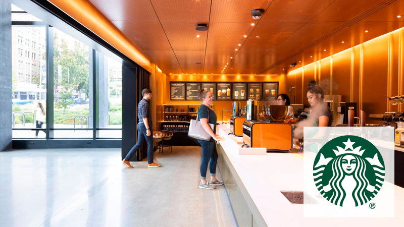 A person ordering at the counter at Starbucks in Population Health building.