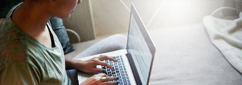 A person typing on a laptop.