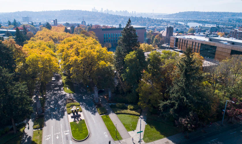 Aerial view of the north entrance to UW with Seattle in the distance