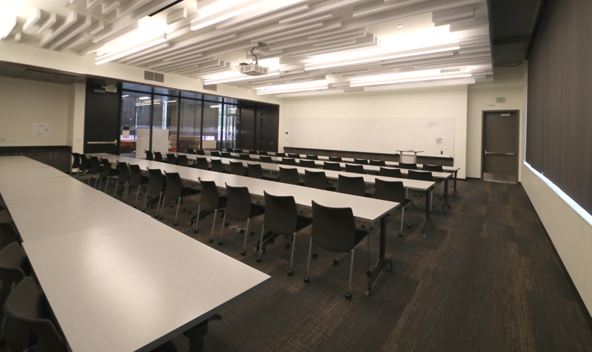 A large room with desks and chairs.