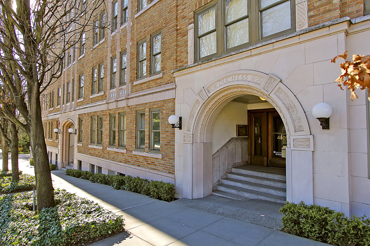 A brick building with an archway entrance.