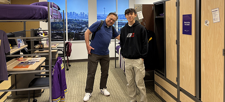 father and son in model room at U Bookstore