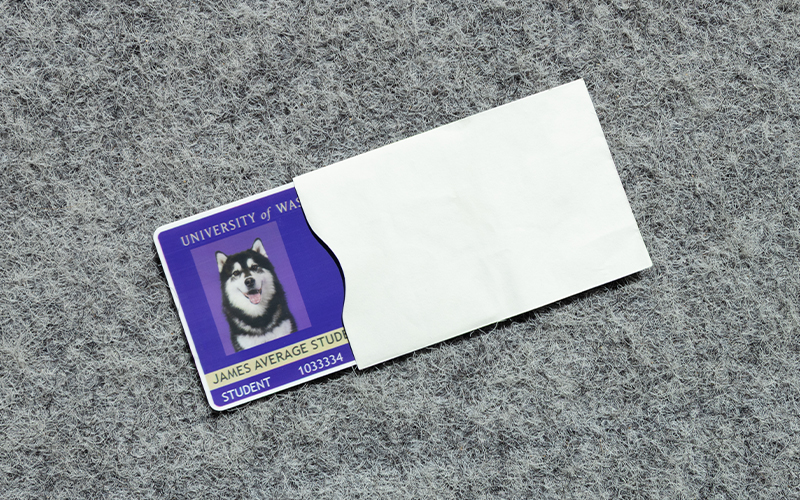 Protective pouch made of paper and other materials inside that is designed to block unauthorized scanning of RFID-enabled cards and documents.
