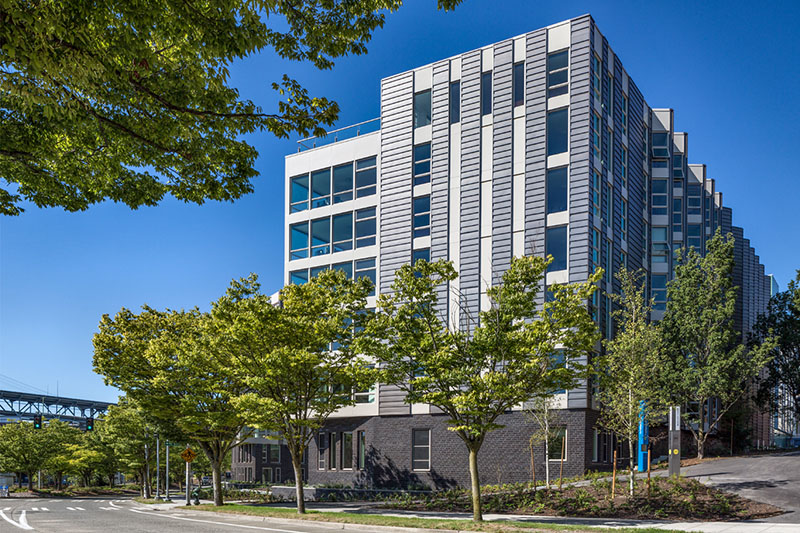 Mercer Court Graduate housing building on a sunny day